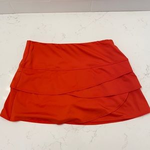 Orange lucky in love tennis skirt